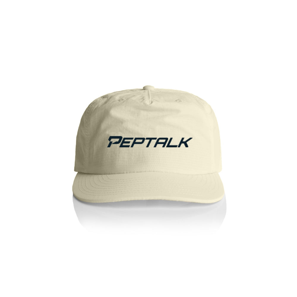 Butter colour surf cap with navy PepTalk logo on white background