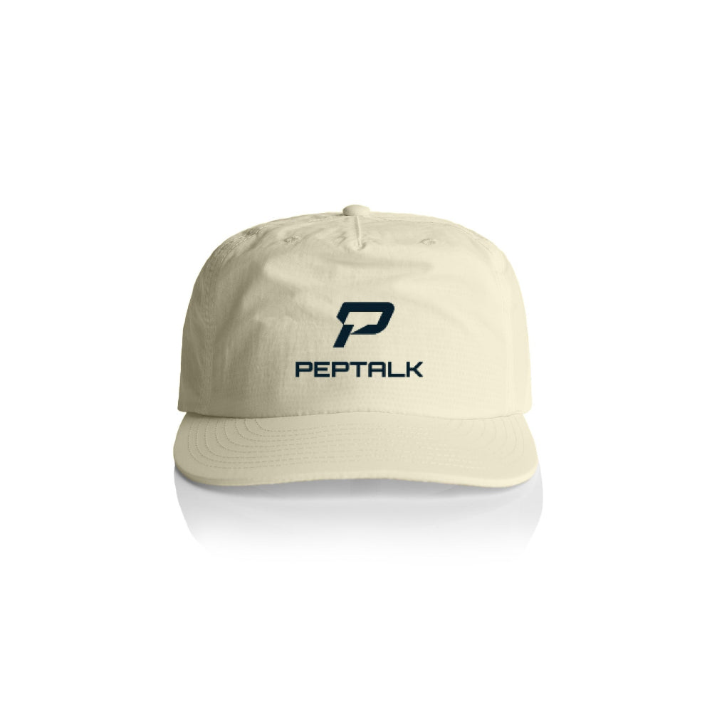 Butter colour surf cap with navy portrait PepTalk logo on white background