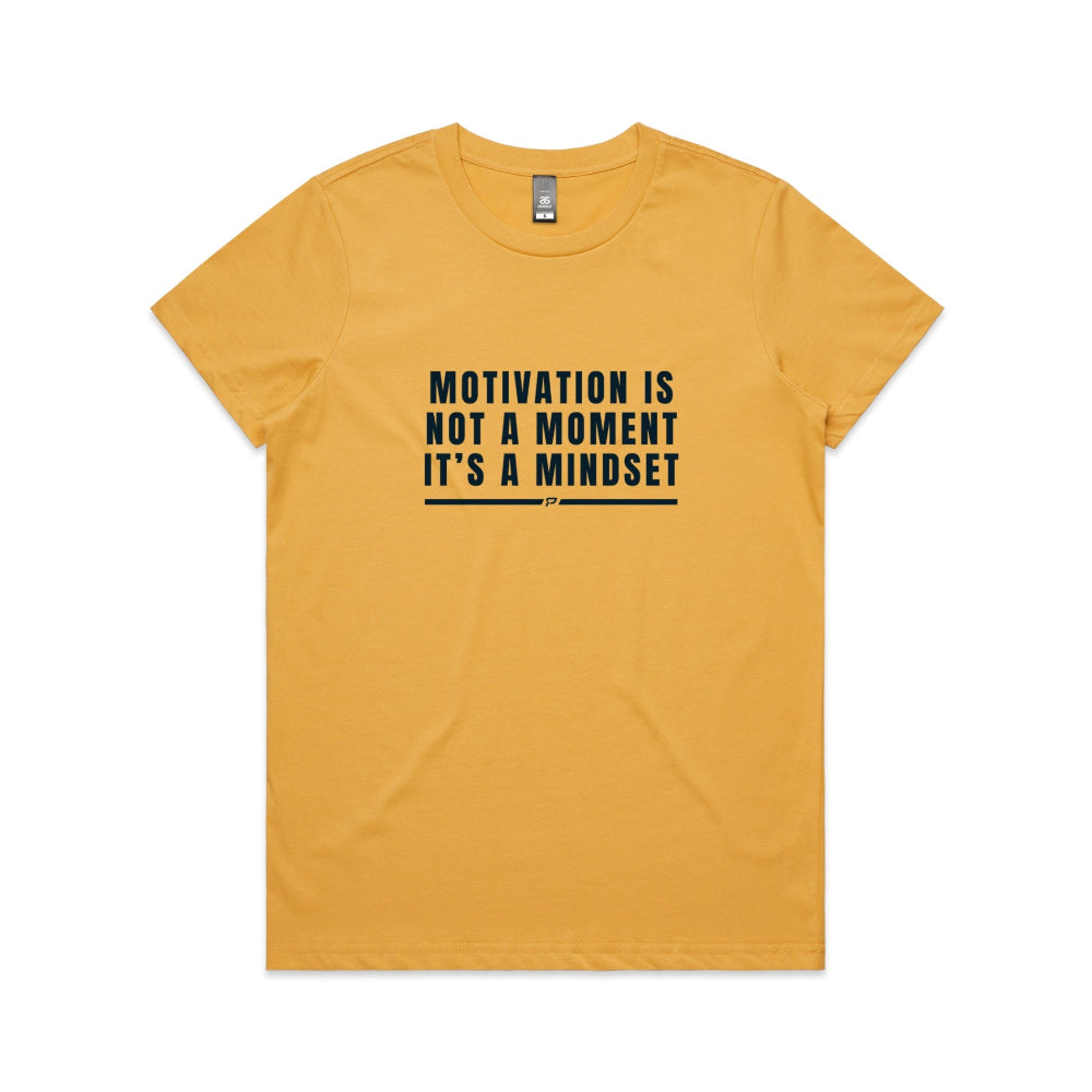 Mustard women's t-shirt with "Motivation Is Not A Moment" design on white background