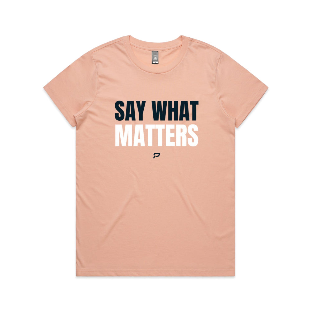 Pale pink women's t-shirt with 'Say What Matters' text on a white background